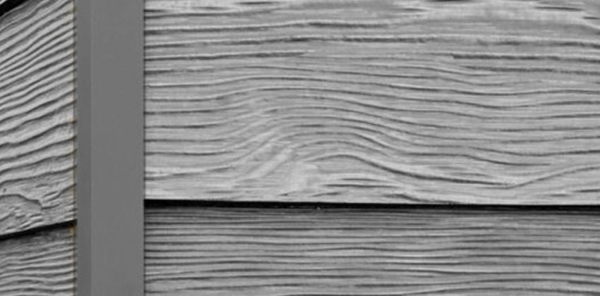 Cascade Slate RusticSeries wood-look composite siding on James Hardie fiber cement lap siding